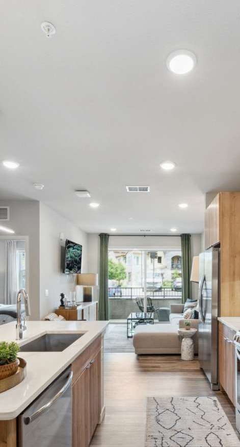 Pristine open-concept living and kitchen area