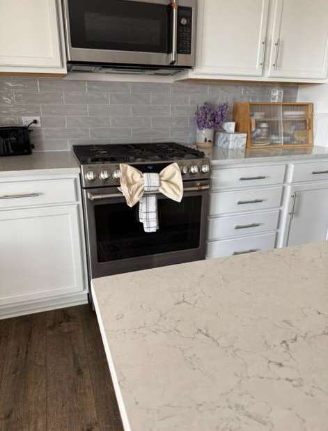 Polished marble countertop and gas range