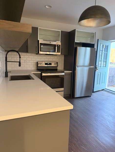Clean modern kitchen with hardwood floors